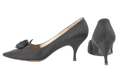 Lot 153 - A pair of Christian Dior black silk shoes,...