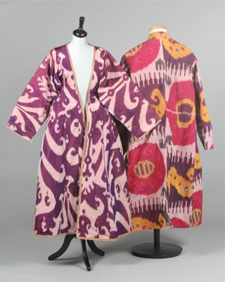 Lot 347 - A woman's purple and white ikat silk chapan,...