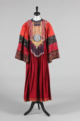 Lot 365 - An Afghan embroidered and beaded dress, 1970s,...