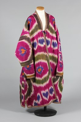 Lot 353 - A woven cotton/silk ikat khalat/coat, Uzbek...