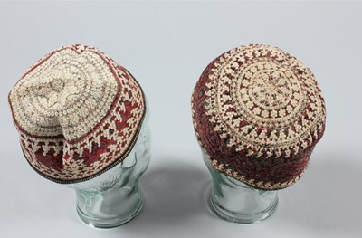 Lot 305 - A group of quilted and embroidered caps,...