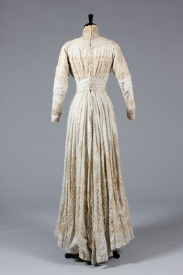 Lot 3 - A blue figured cotton summer gown, circa 1900,...