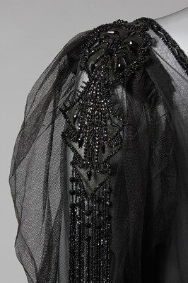 Lot 9 - A beaded black tulle tabard circa 1918, with...