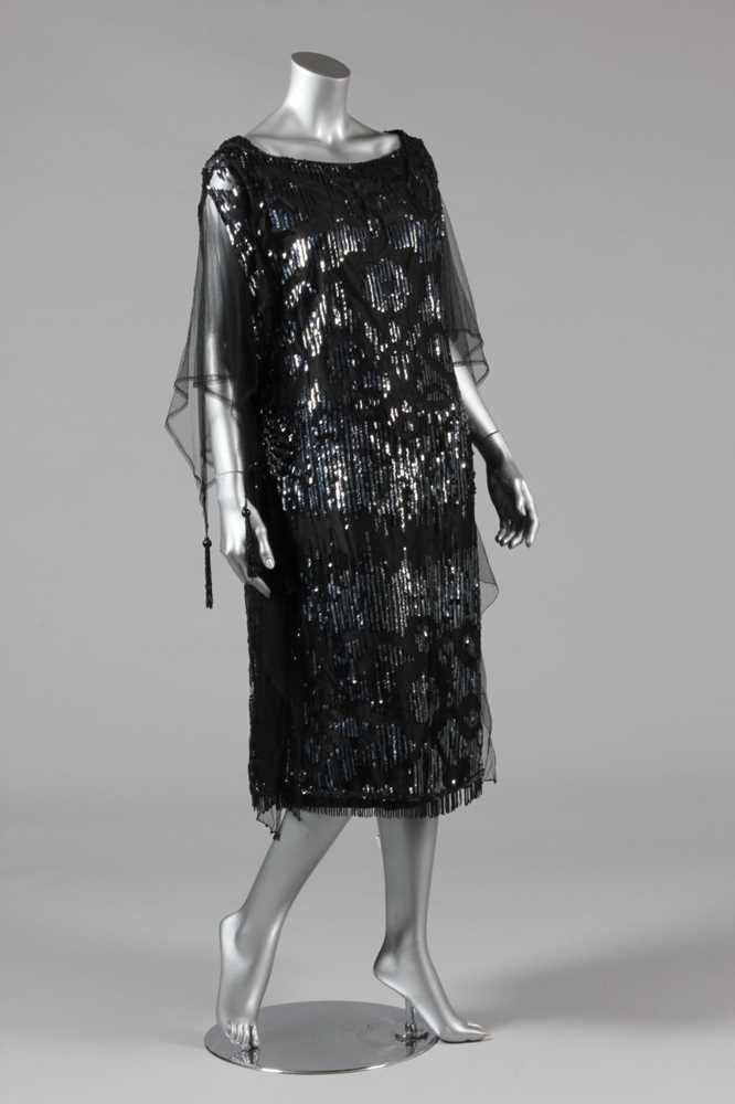 Click for high resolution Lot 11 - A sequinned black tulle tabard dress, early...
