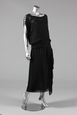 Lot 11 - A sequinned black tulle tabard dress, early...