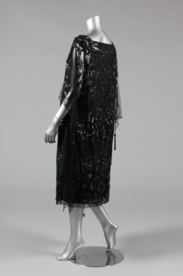 Lot 11 - A sequinned black tulle tabard dress, early...