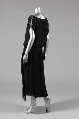 Lot 11 - A sequinned black tulle tabard dress, early...