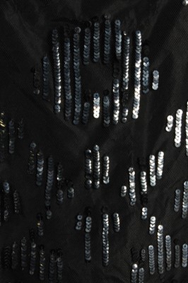 Lot 11 - A sequinned black tulle tabard dress, early...