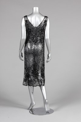 Lot 14 - A black sequined tabard circa 1918-20, the...