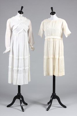 Lot 18 - Two muslin girl's dresses, circa 1918 and 1928,...