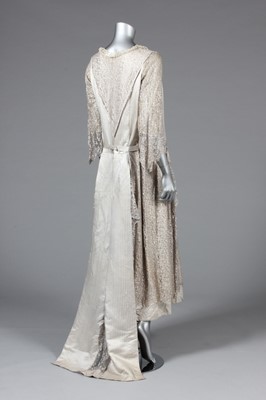 Lot 23 - A striped satin and silver lace evening gown,...
