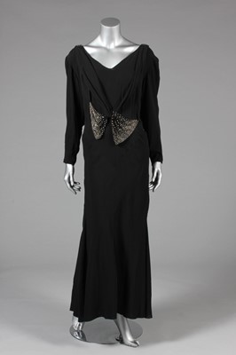 Lot 25 - A black georgette evening gown with rhinestone...