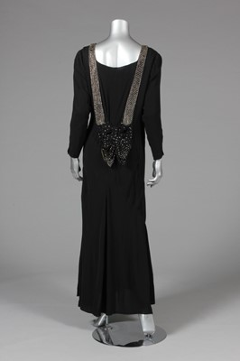 Lot 25 - A black georgette evening gown with rhinestone...