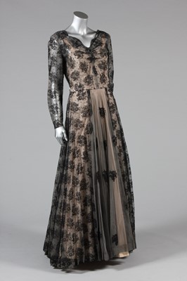 Lot 43 - A black lace and pink rayon evening gown, late...