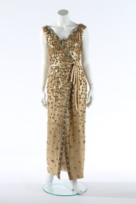 Lot 159 - A Pierre Balmain beaded gold cloqué evening...