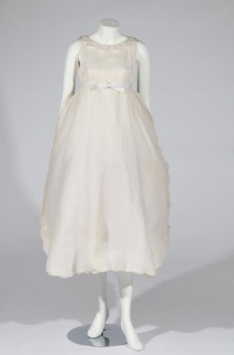 Lot 124 - A Courrèges couture evening gown or bridal...