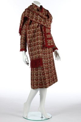 Lot 175 - A Chanel couture tweed suit, early 1970s,...