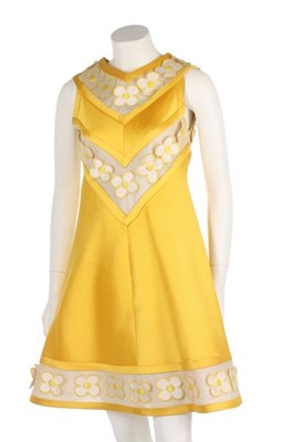 Lot 185 - An André Courrèges yellow ziberline mini-dress,...