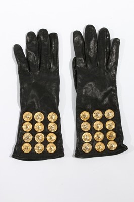 Lot 207 - A pair of Gianni Versace black leather gloves,...