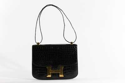 Lot 2 - An Hermès Constance black crocodile handbag,...