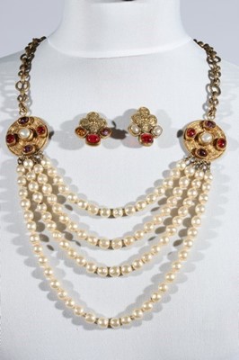 Lot 13 - A Chanel four-strand necklace, signed and...