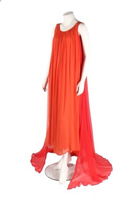 Lot 207 - An Yves Saint Laurent couture orange chiffon...