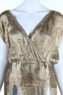 Lot 52 - A beaded cloth of gold over-dress, early 1920s,...