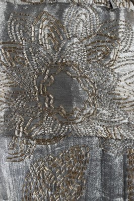 Lot 52 - A beaded cloth of gold over-dress, early 1920s,...