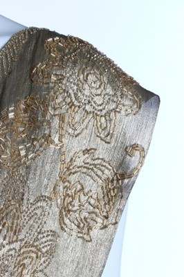 Lot 52 - A beaded cloth of gold over-dress, early 1920s,...