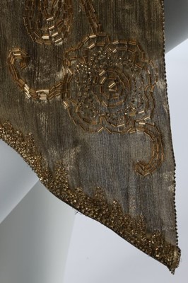 Lot 52 - A beaded cloth of gold over-dress, early 1920s,...