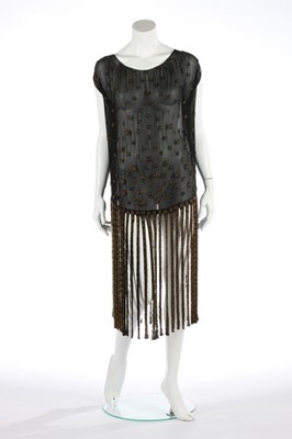 Lot 50 - A beaded black chiffon flapper dress with...