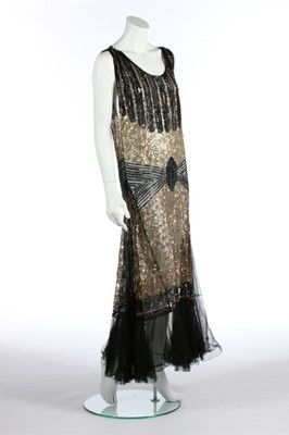Lot 80 - A black and gold sequined tulle evening gown,...
