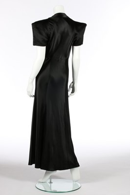 Lot 74 - A black satin bias cut evening gown,...