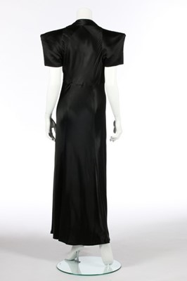 Lot 74 - A black satin bias cut evening gown,...