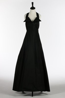 Lot 71 - A black taffeta bias cut evening gown, circa...