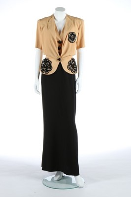 Lot 66 - A Molyneux couture apricot and black crpe...