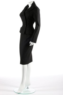 Lot 103 - A Christian Dior black wool suit, circa 1953,...