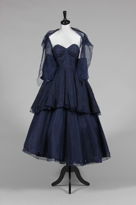 Lot 457 - A blue lace ball gown, mid 1950s, labelled...