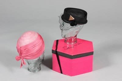 Lot 6 - Two Schiaparelli hats, early 1960s, one of...