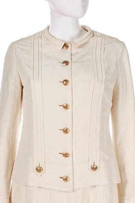 Lot 27 - A Chanel couture ivory silk ensemble, 1974,...