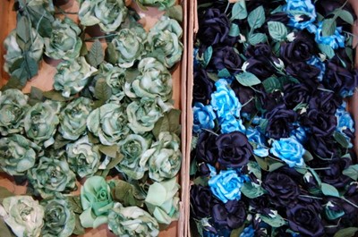 Lot 155 - Five boxes of silk flowers, mainly in blues...