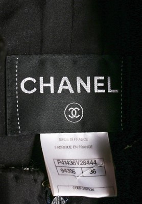 Lot 36 - A Chanel black bouclé wool ensemble trimmed...