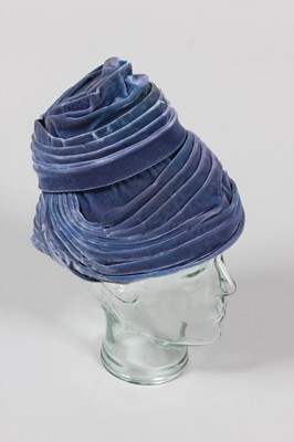 Lot 191 - A Balenciaga domed blue velvet hat, 1950s,...