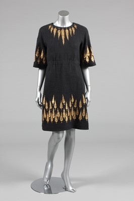 Lot 210 - A Chanel gold stencilled slubbed black cotton...