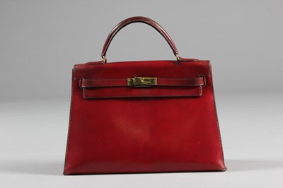 Lot 16 - An Hermès burgundy leather Kelly bag, 1960s,...