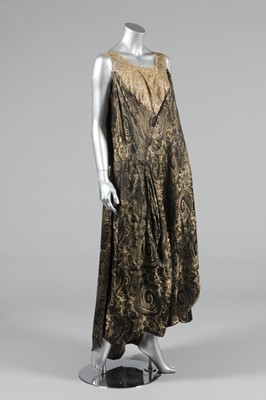 Lot 223 - A black and gold lame evening gown, early...