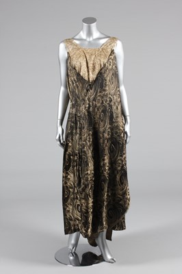 Lot 223 - A black and gold lame evening gown, early...