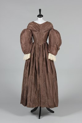 Lot 333 - A brown silk day dress circa 1835, together...