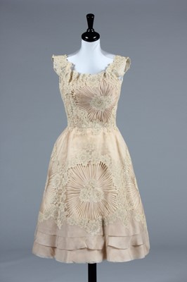 Lot 28 - A Ceil Chapman ivory organdy cocktail dress,...