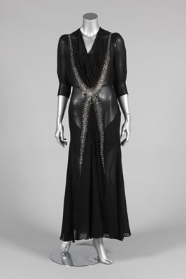 Lot 368 - A good black chiffon evening gown adorned with...